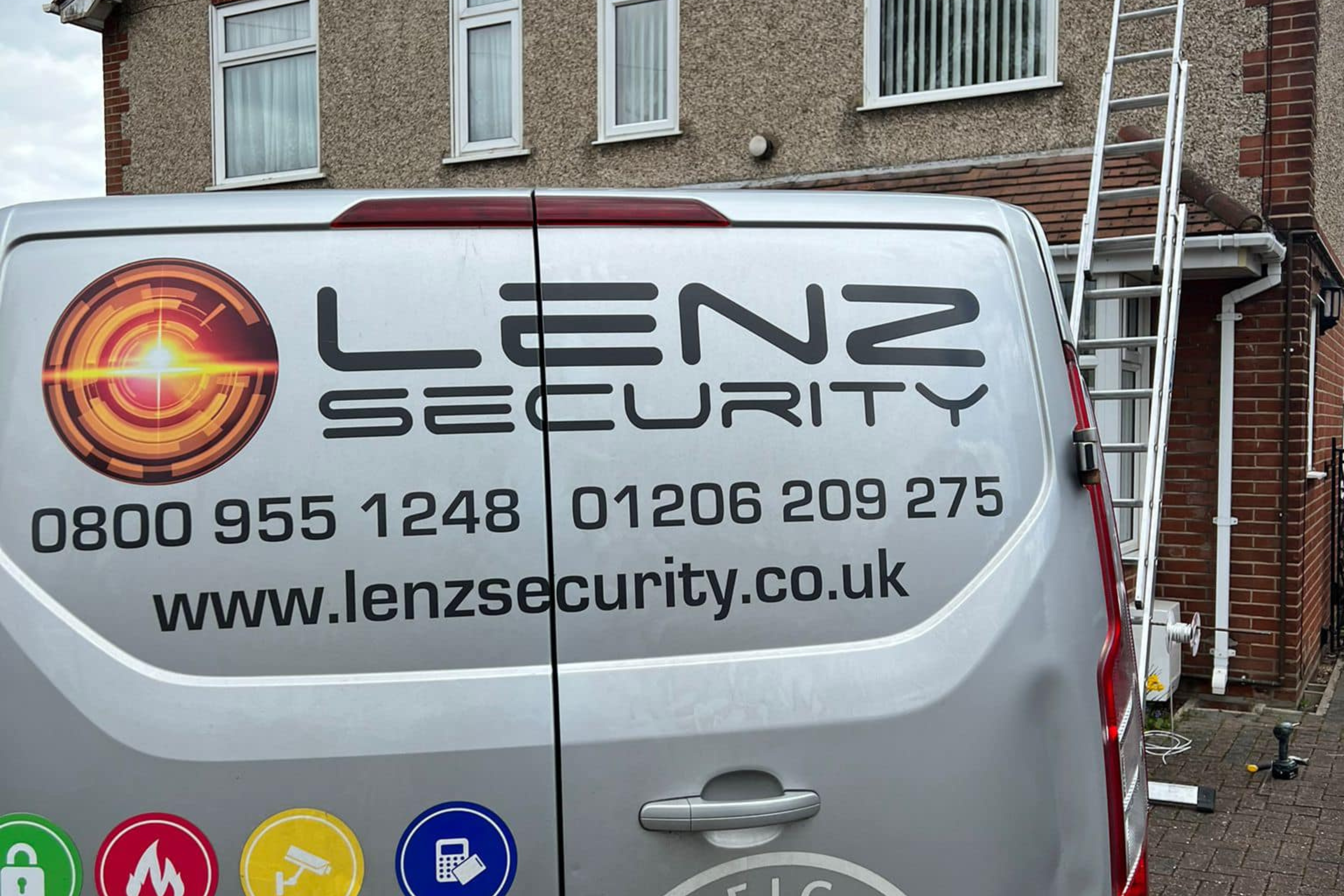 Security Systems Lenz Featured Security systems installer Lenz Security van from back in front of house